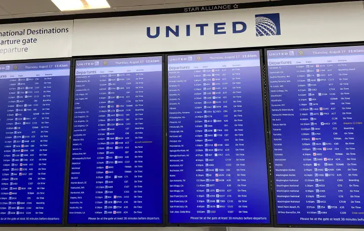 Departures screen at an airport.